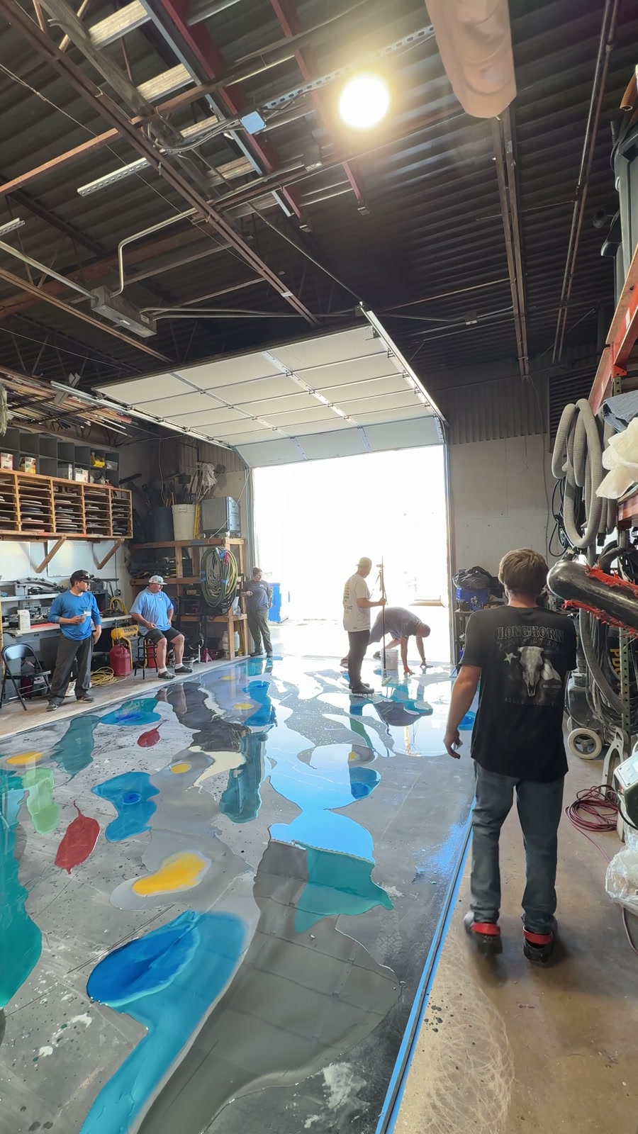 Metallic coating being spread across a floor