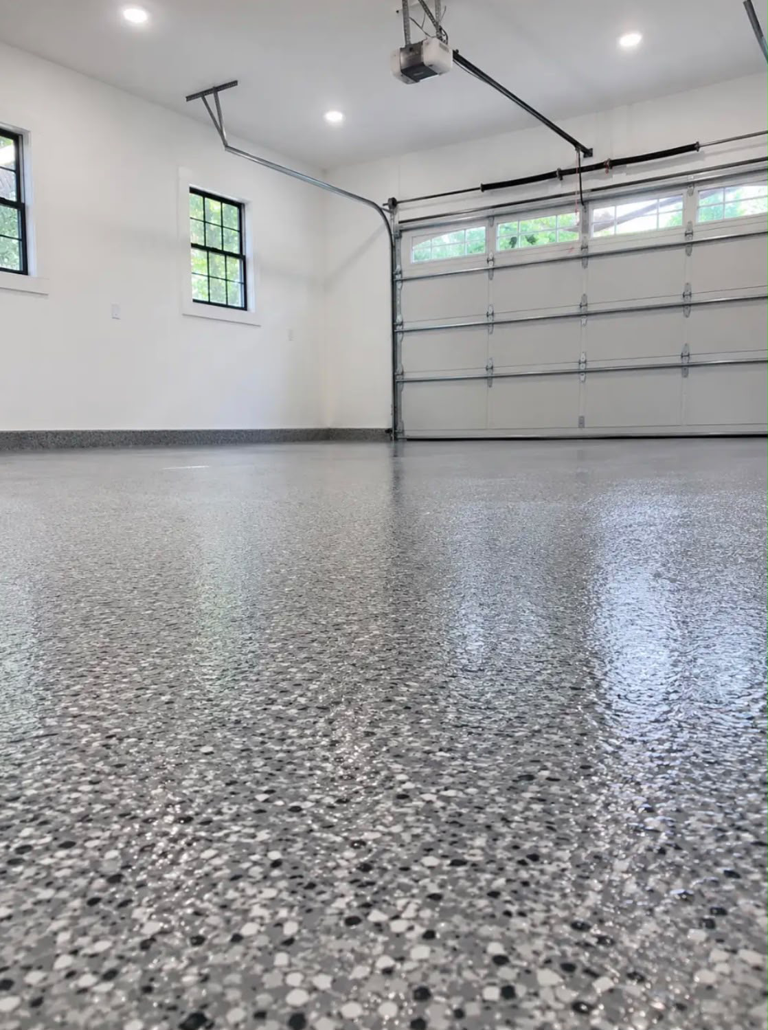 Supplied reference photograph of a grey flake floor in a bright white garage